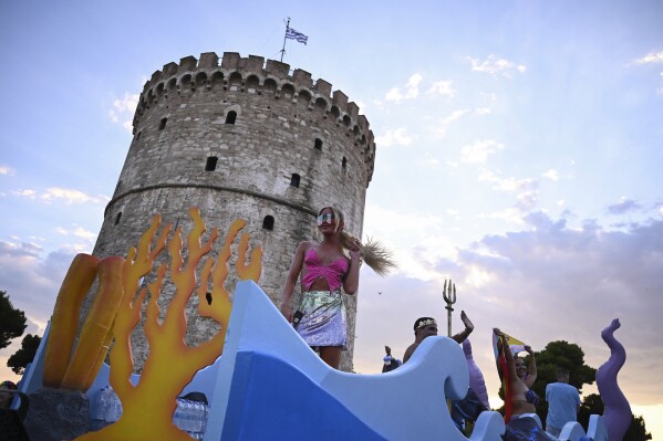 Revellers gather in front of the White Tower during EuroPride, a pan-European international LGBTI event featuring a Pride parade which is hosted in a different European city each year, in the northern port city of Thessaloniki, Greece, Saturday, June 29, 2024. (AP Photo/Giannis Papanikos)