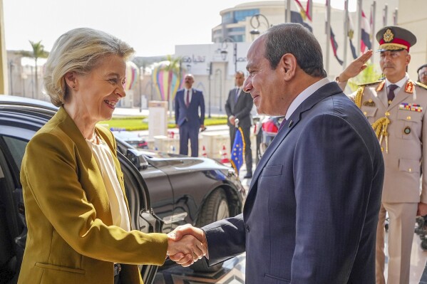 In this photo provided by Egypt's Presidency Media Office, Egyptian President Abdel-Fattah el-Sissi, greets President of the European Commission, Ursula von der Leyen, before the opening of the EU-Egypt Investment Conference in Cairo, Egypt, Saturday, June 29, 2024. The two-day conference is part of the Egypt-EU strategic partnership which both parties signed earlier this year aiming at injecting investment in Egypt economy. (Egyptian Presidency Media Office via AP)