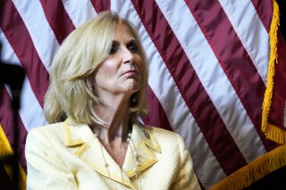 Mississippi Attorney General Lynn Fitch waits to speak at a Trump for President rally in Jackson, Miss., Thursday, June 6, 2024. Fitch was named a defendant in a lawsuit filed Friday, June 7, 2024, in federal court over a new Mississippi law requiring users of websites and other digital services to register their age. The suit by the tech industry group NetChoice contends the law will unconstitutionally limit access to online speech for minors and adults. (AP Photo/Rogelio V. Solis)
