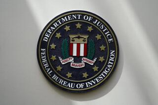 FILE - The FBI seal is pictured in Omaha, Neb., Aug. 10, 2022. The number of hate crimes in the U.S. jumped again in 2021, continuing an alarming rise, according to FBI data released Monday, March 13, 2023. Most victims were targeted due to race or ethnicity, followed by sexual orientation and religion. (AP Photo/Charlie Neibergall, File)
