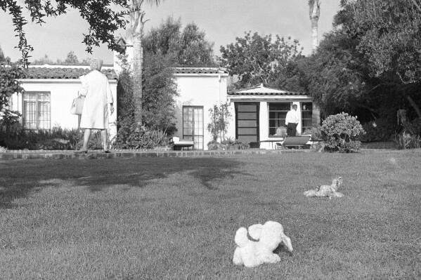 FILE - The backyard of the home where Marilyn Monroe lived is shown after she was found dead in Hollywood, August 5, 1962. The Los Angeles City Council voted to declare the home where Marilyn Monroe briefly lived and died a historic cultural monument in order to save it from demolition by its owners. (AP Photo/Harold Filan, File)