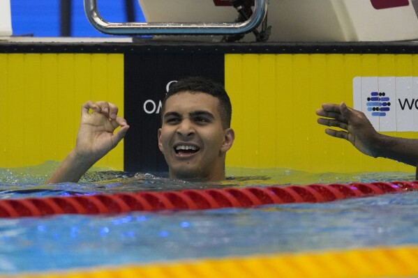 FILE - Palestinian swimmer Yazan Al Bawwab reacts during the men's 100m freestyle heats at the World Swimming Championships in Fukuoka, Japan, Wednesday, July 26, 2023. Six athletes, including one woman, were selected to represent Palestine at the Paris Olympics, an official from the Palestinian Olympic Committee told The Associated Press on Monday July 1, 2024. (AP Photo/Lee Jin-man, File)