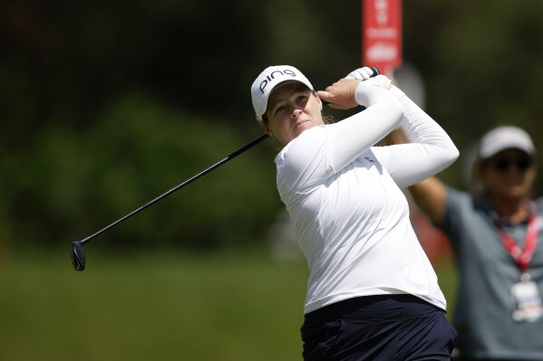 Ally Ewing watches her tee shot on the eighth hole during the first round of the Dow Championship LPGA golf tournament Thursday, June 27, 2024, at Midland Country Club in Midland, Mich. (AP Photo/Al Goldis)