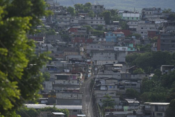 Houses sit on the hillside in Tila, Chiapas state, Mexico, Tuesday, June 18, 2024. Residents are fleeing the town due to organized crime-related violence. (AP Photo/Fernando Llano)
