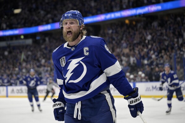 FILE - Tampa Bay Lightning center Steven Stamkos reacts after his goal during the first period of Game 6 of the NHL hockey Stanley Cup Finals against the Colorado Avalanche on Sunday, June 26, 2022, in Tampa, Fla. The Nashville Predators made a big splash in the opening minutes of NHL free agency by signing Steven Stamkos, Jonathan Marchessault and Brady Skjei. (AP Photo/Phelan Ebenhack, File)