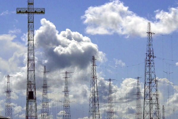 FILE - A view of the antennas of the Vatican Radio, which beams the Pope's words around the world, is seen in Santa Maria di Galeria, on the outskirts of Rome, on April 11, 2001. Pope Francis decreed Wednesday that an area of northern Rome, long the source of controversy because of electromagnetic waves emitted by Vatican Radio towers there, will now house solar panels to fuel Vatican City. (AP Photo/ Gregorio Borgia, File)