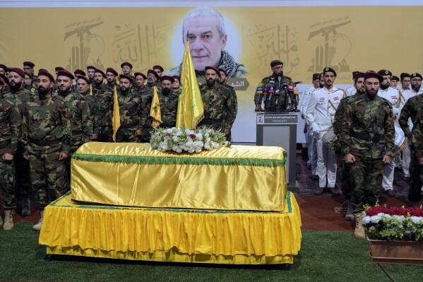 Hezbollah fighters attend the funeral procession of their comrade, senior commander Mohammad Naameh Nasser, who was killed by an Israeli airstrike that hit his car in the southern costal town of Tyre, in the southern suburbs of Beirut, Lebanon, Thursday, July 4, 2024. The strike took place as global diplomatic efforts have intensified in recent weeks to prevent escalating clashes between Hezbollah and the Israeli military from spiralling into an all-out war that could possibly lead to a direct confrontation between Israel and Iran. (AP Photo/Bilal Hussein)