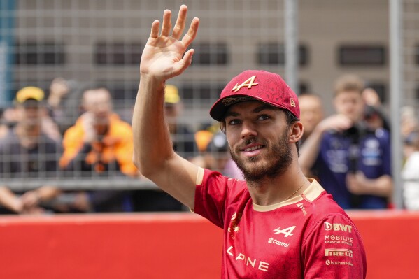Alpine driver Pierre Gasly of France waves during the drivers parade ahead of the Chinese Formula One Grand Prix, Shanghai, China, on April 21, 2024. Formula One driver Pierre Gasly has signed a multi-year deal contract extension with the Alpine team. (AP Photo, File)