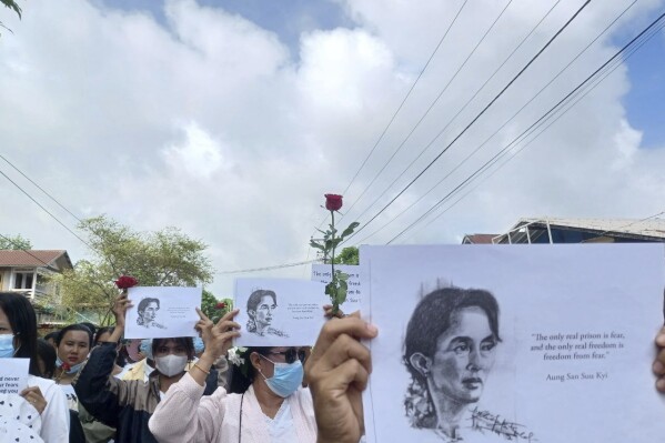 Demonstrators hold papers printed with Aung San Suu Kyi’s famous quote ''The only real prison is fear, and the only real freedom is freedom from fear'' as they rally to mark her 79th birthday in Launglon township in Tanintharyi region, Myanmar, Wednesday, June 19, 2024. (Democracy Movement Strike Committee-Dawei via AP)