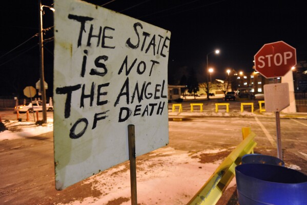 FILE - A sign placed by death penalty opponents sits in front of the Indiana State Prison in Michigan City, Ind. Thursday, Dec. 10, 2009 in protest of the execution of Matthew Eric Wrinkles, who was the last Indiana inmate to be executed. Republican Governor Eric Holcomb said Wednesday, June 26, 2024, the state is seeking to resume executions after acquiring a drug used in lethal injections. (AP Photo/Joe Raymond, File)