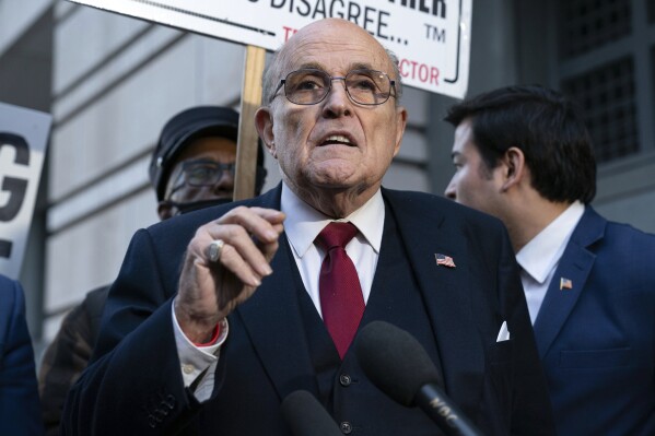 FILE - Rudy Giuliani speaks during a news conference outside federal court in Washington, Dec. 15, 2023. Giuliani's creditors, including the two former Georgia election workers who won a $148 million defamation judgment against him, are opposing his attempt to convert his bankruptcy into a liquidation, saying they'll likely ask that the case be thrown out instead because of what they call his flouting of bankruptcy laws. (AP Photo/Jose Luis Magana, File)