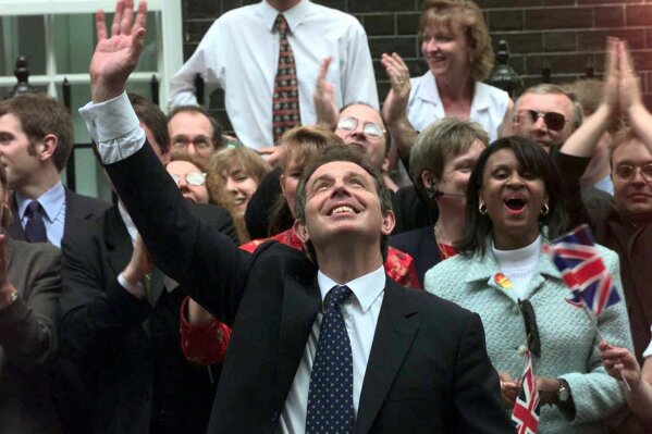 FILE - Britain's new Prime Minister Tony Blair, waves to well wishers in Downing Street, London, May 2, 1997. The upcoming general election on July 4, 2024, is widely expected to lead to a change of government for the first time in 14 years. In 1997, the Labour Party had been out of power for longer than it has been now - 18 years - and it was quite a turnaround when Labour, under the leadership of the youthful Tony Blair, won the May 1, 1997 general election by a landslide majority of 179 seats. (AP Photo/Max Nash, file)