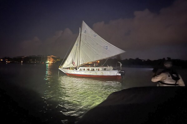 In this photo provided by the Monroe County Sheriff's Office, a sailboat carrying a group of over 100 migrants from Haiti is shown after they arrived off Key West, Fla., early Wednesday, June, 26, 2024. (Monroe County Sheriff's Office via AP)