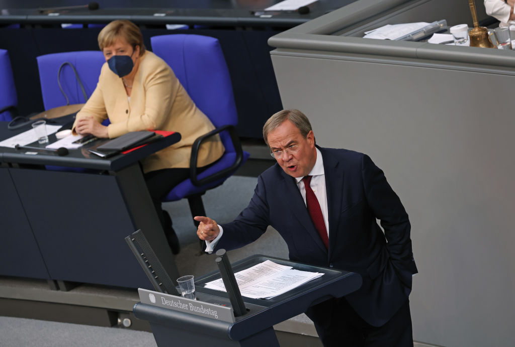 Angela Merkel looks on as Armin Laschet, chancellor candidate of the Christian Democrats (CDU/CSU), speaks at the final session of the Bundestag before federal parliamentary elections take place on 26 September, 2021.