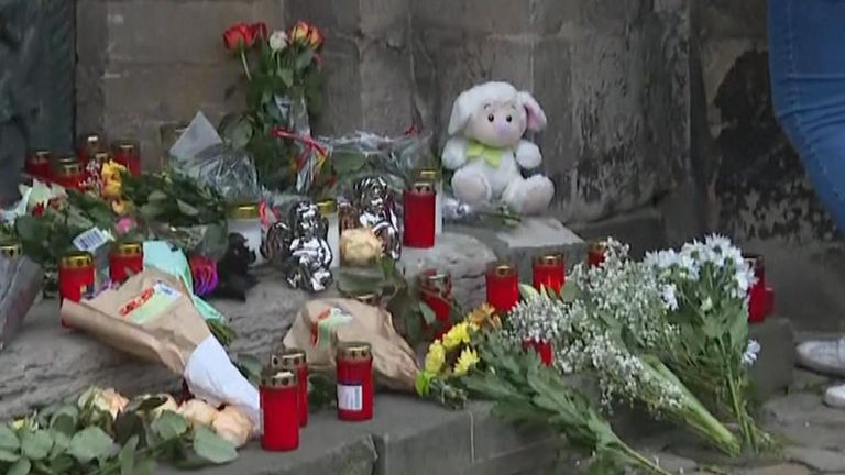 Flowers and candles are laid in Magdeburg for victims of a driver who accelerated into a crowd