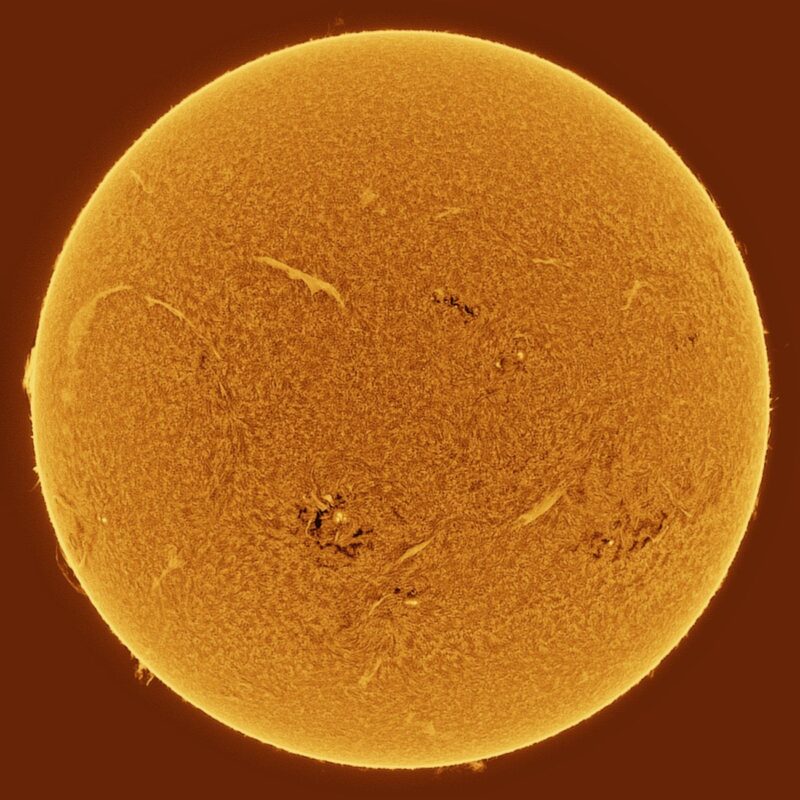 The sun, seen as a large yellow sphere with a mottled surface.