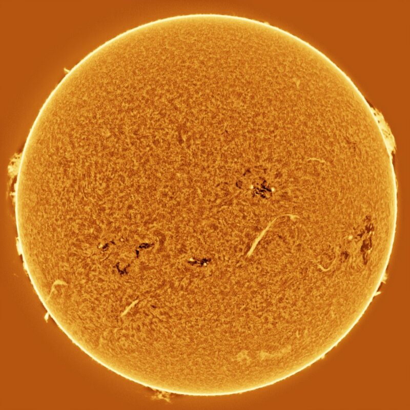 The sun, seen as a large yellow sphere with a mottled surface.