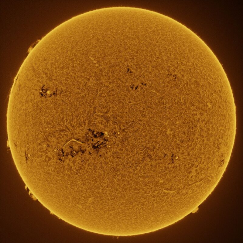 The sun, seen as a large yellow sphere with a mottled surface.