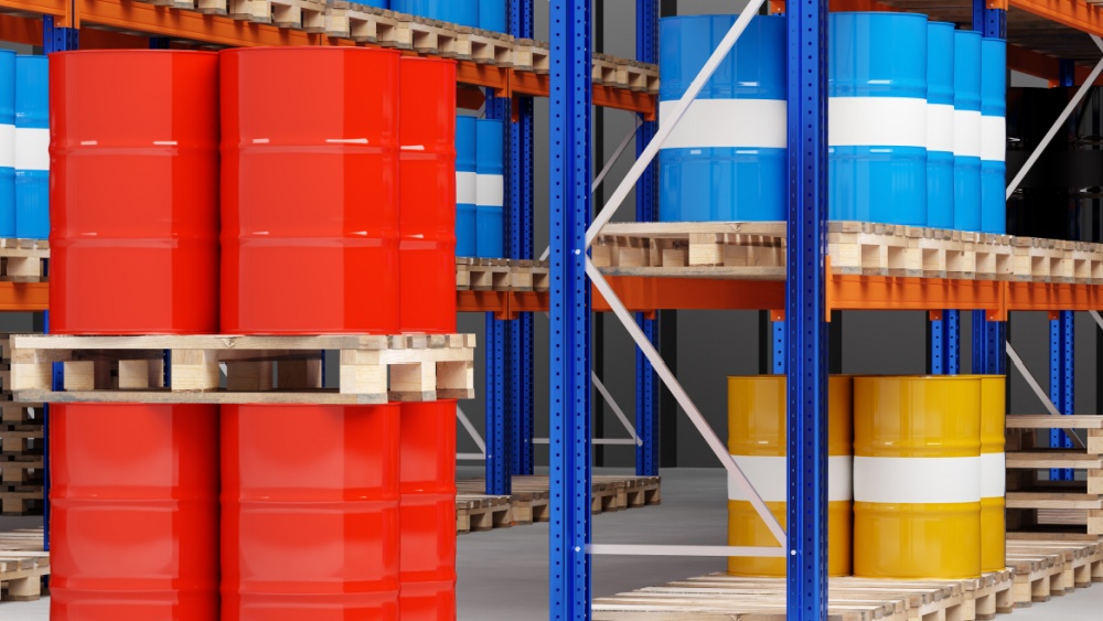 Barrels of chemicals in a warehouse.