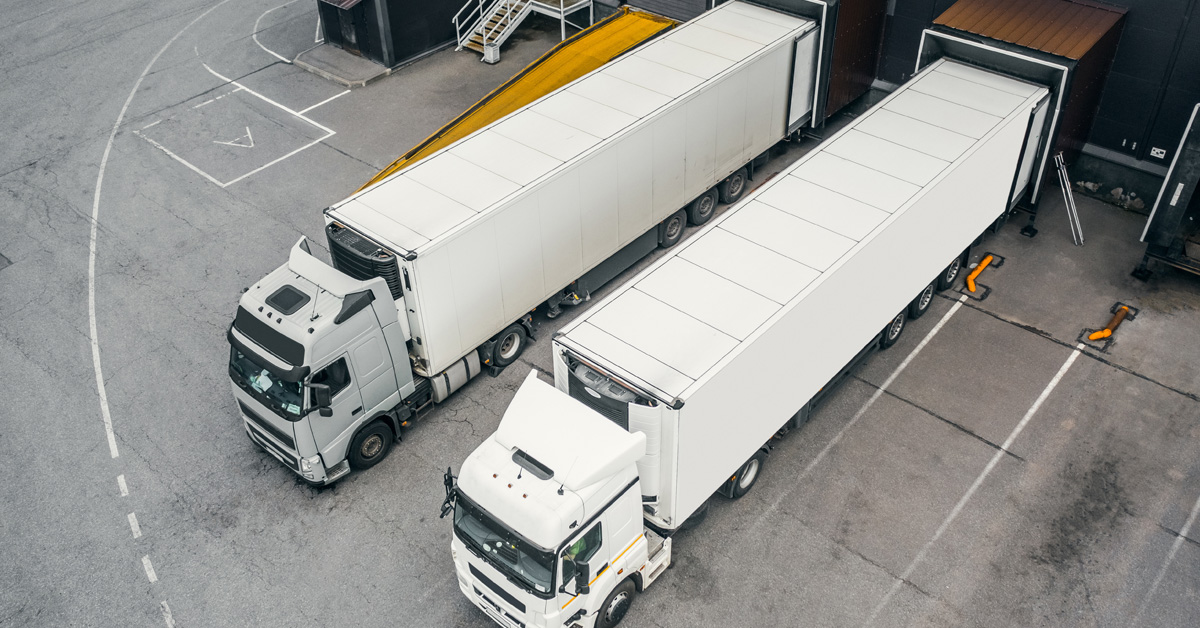 Two trucks loading in the distribution hub