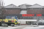 An ambulance outside an NHS emergncy room during winter snow