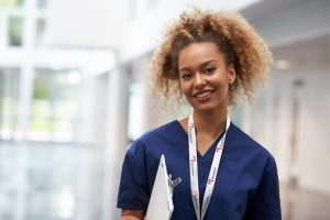 An aortic nurse wearing a lanyard for the Aortic Dissection Charitable Trust