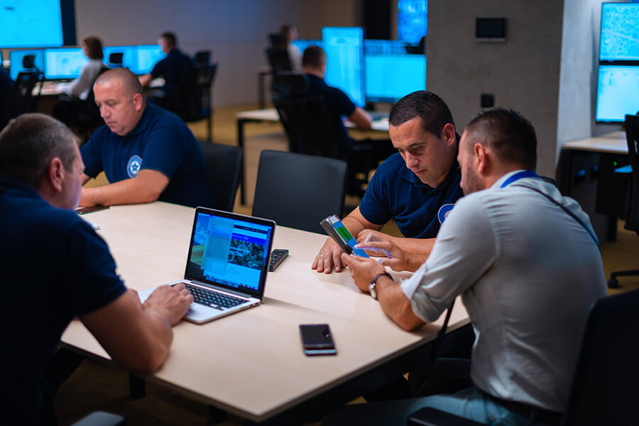 Security Personell Meeting In A Main Security Data Center Office