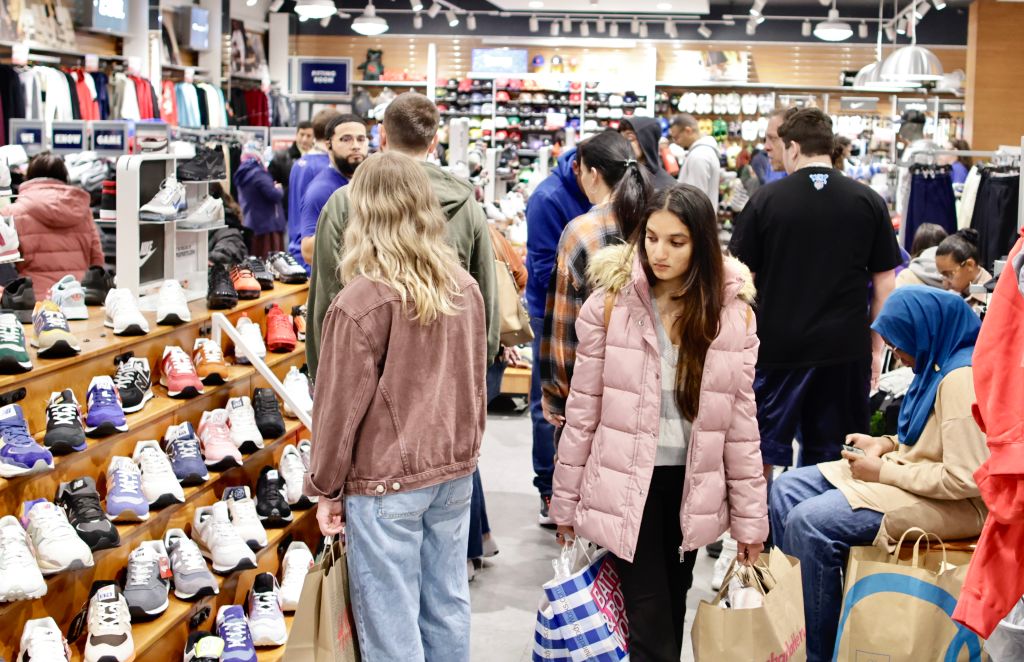 EAST RUTHERFORD, NJ - NOVEMBER 25: A woman carries shopping bags as customers visit the American Mall dream mall during Black Friday on November 25, 2022 in East Rutherford, New Jersey. Black Friday, the day after Thanksgiving, is traditionally regarded as the start of the holiday shopping season, with shoppers flocking to stores and online for bargains, but with consumer confidence down, retailers are bracing for a considerably slower Black Friday. (Photo by Kena Betancur/Getty Images)