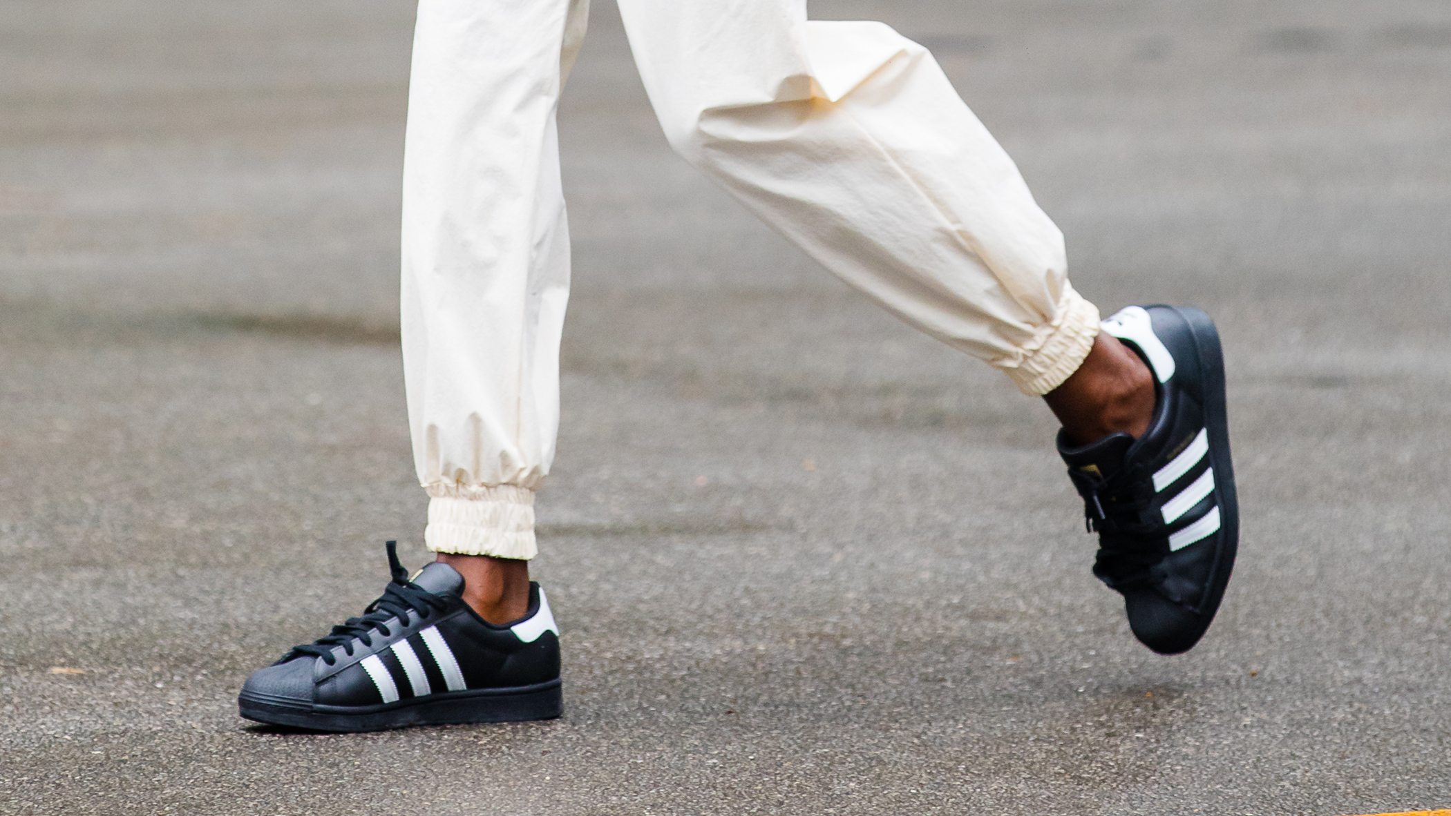 Person walking in one of the best adidas leather shoes