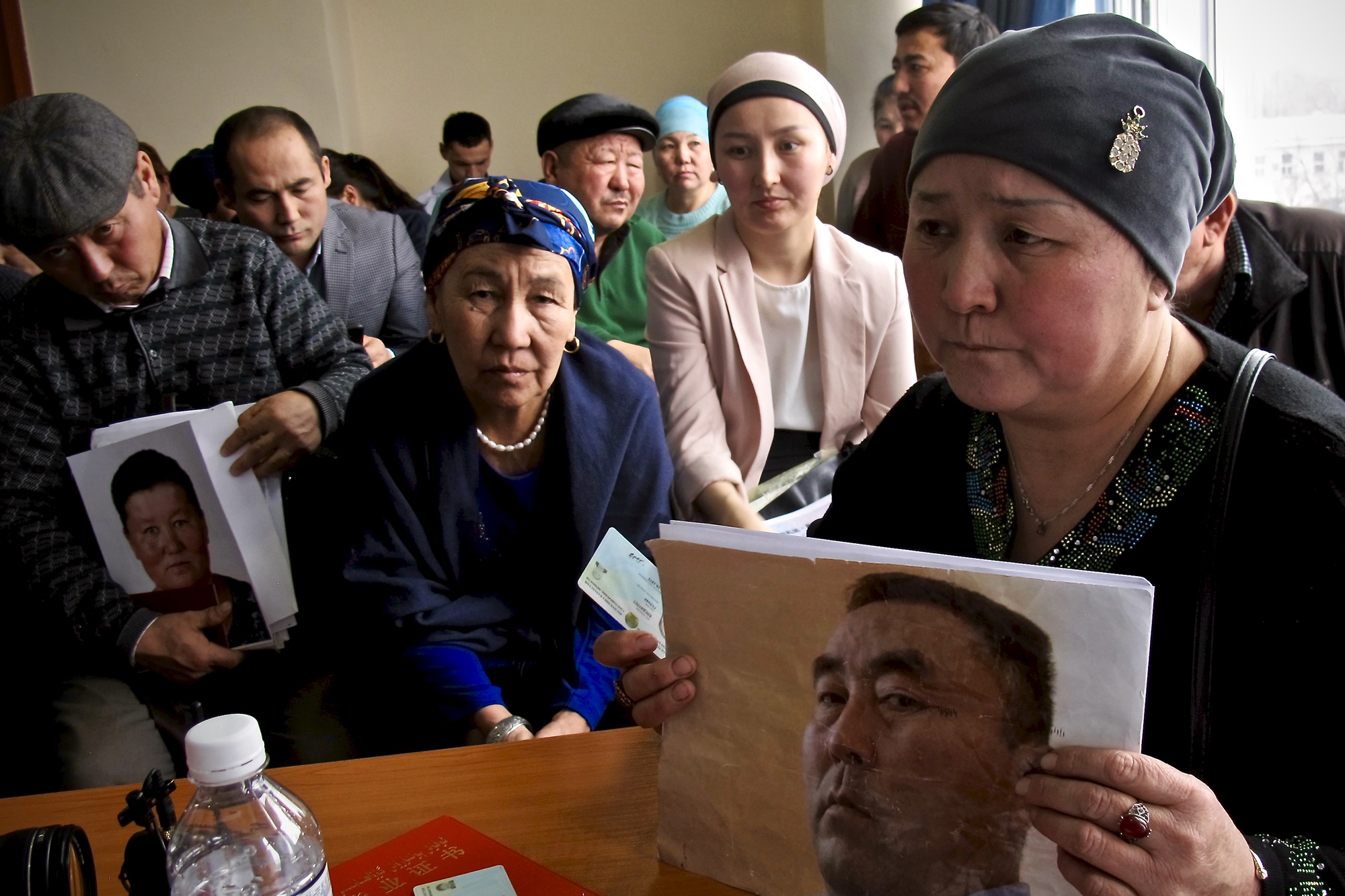 Gulnur Kosgeulet shows a photo of her husband, Ekpor Sorsenbek, whom she believes is in a re-education camp in Xinjiang, in Almaty, Kazakhstan, on Jan. 21. (Reid Standish for Foreign Policy)