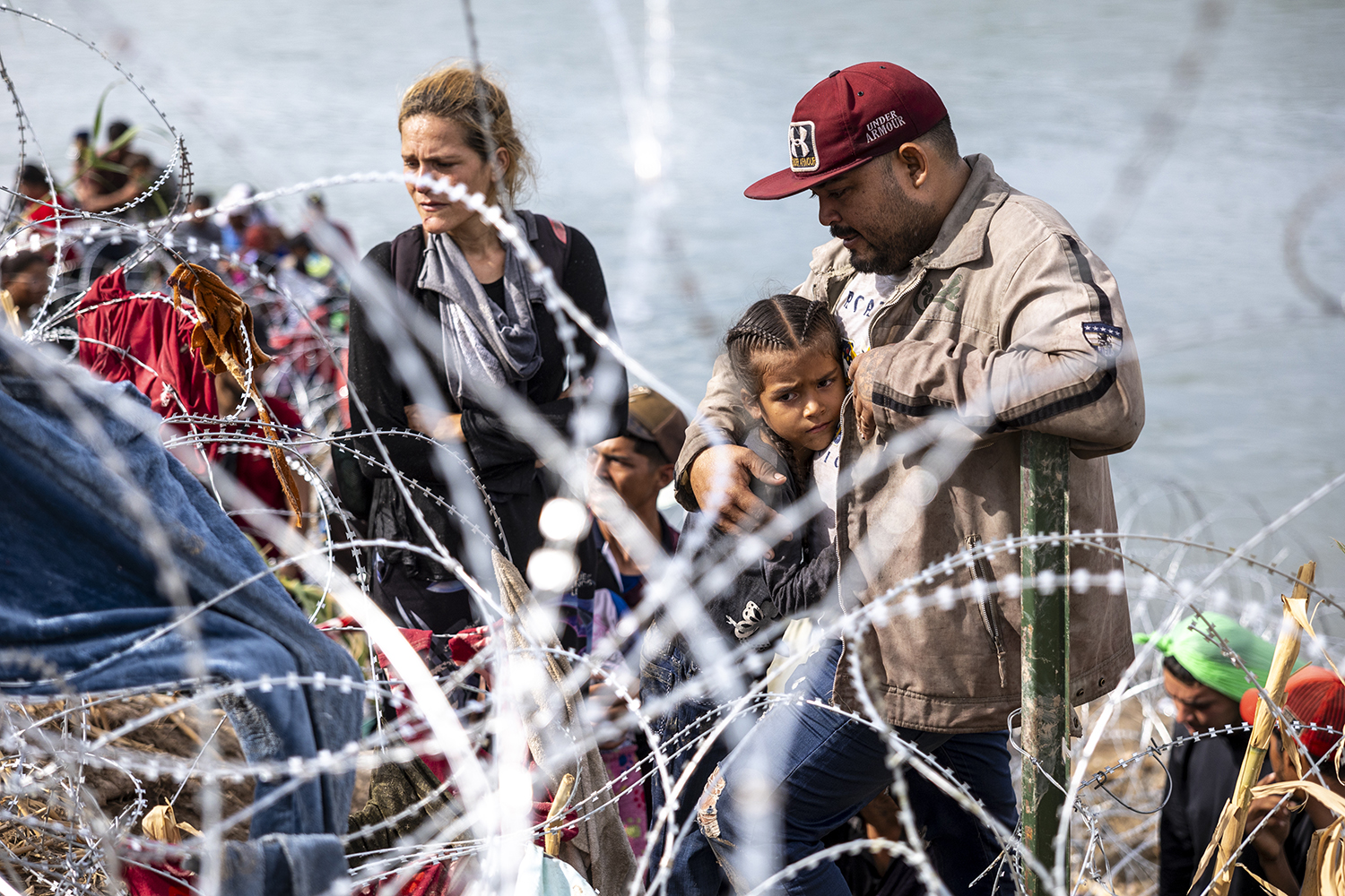 Venezuelan immigrant Louis Sanchez embraces his daughter Nilfa.