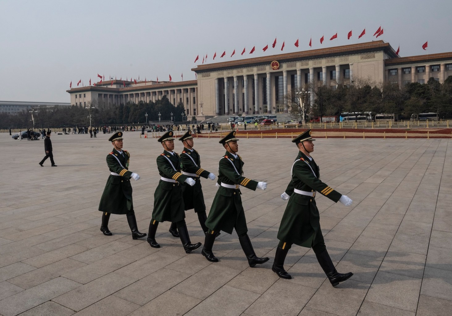 Members of a Chinese People’s Liberation Army honor guard march in Tiananmen Square after the closing session of the Chinese People’s Political Consultative Conference in Beijing on March 10.