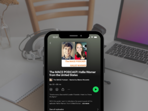 Graphic of the MACE podcast episode featuring Hallie Warner playing on Spotify displayied on a phone screen.