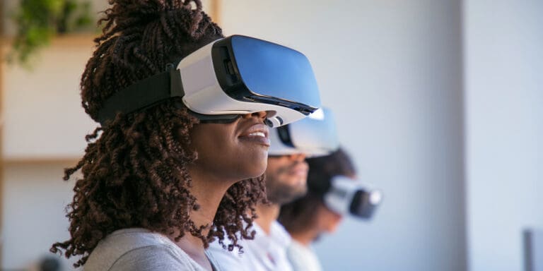 Why subscription services can’t keep customers; 3 people gaming, wearing VR headsets