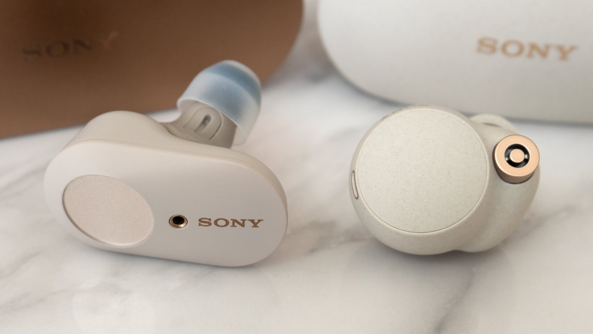 The Sony WF-1000XM4 buds (right) are smaller and lighter than the Sony WF-1000XM3s (left), but they’re still quite a bit larger than most of the premium wireless earbud options out there.