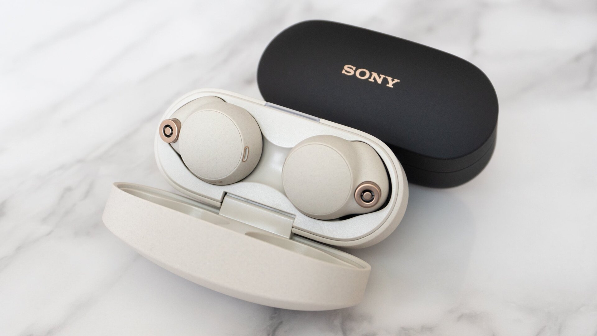 The Sony WF-1000XM4 wireless earbuds are available in black or ‘80s desktop tower PC beige color options.