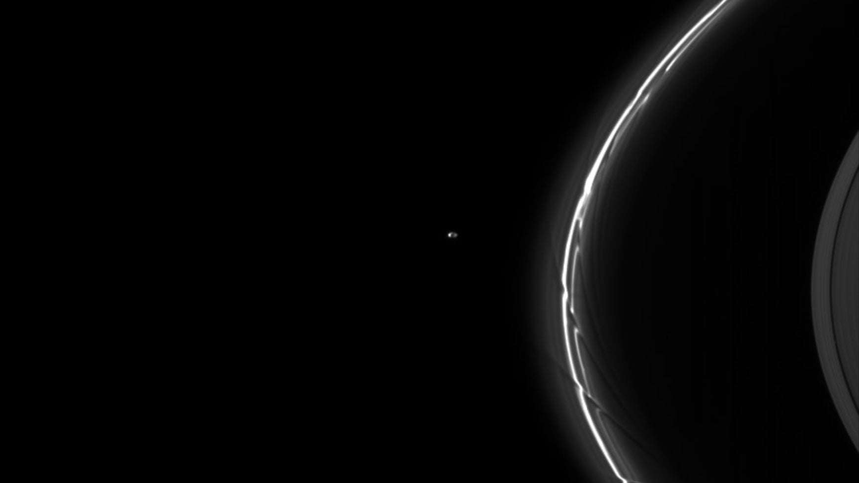 A Cassini image of shepherd moons acting on Saturn’s F ring.