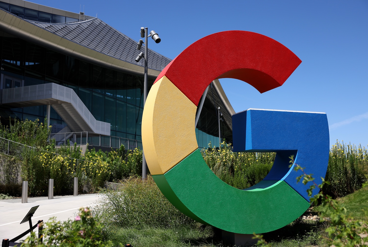 The Google logo is displayed in front of company headquarters during the Made By Google event on August 13, 2024 in Mountain View, California. Google announced new Pixel phones, watches and AI features at the event.