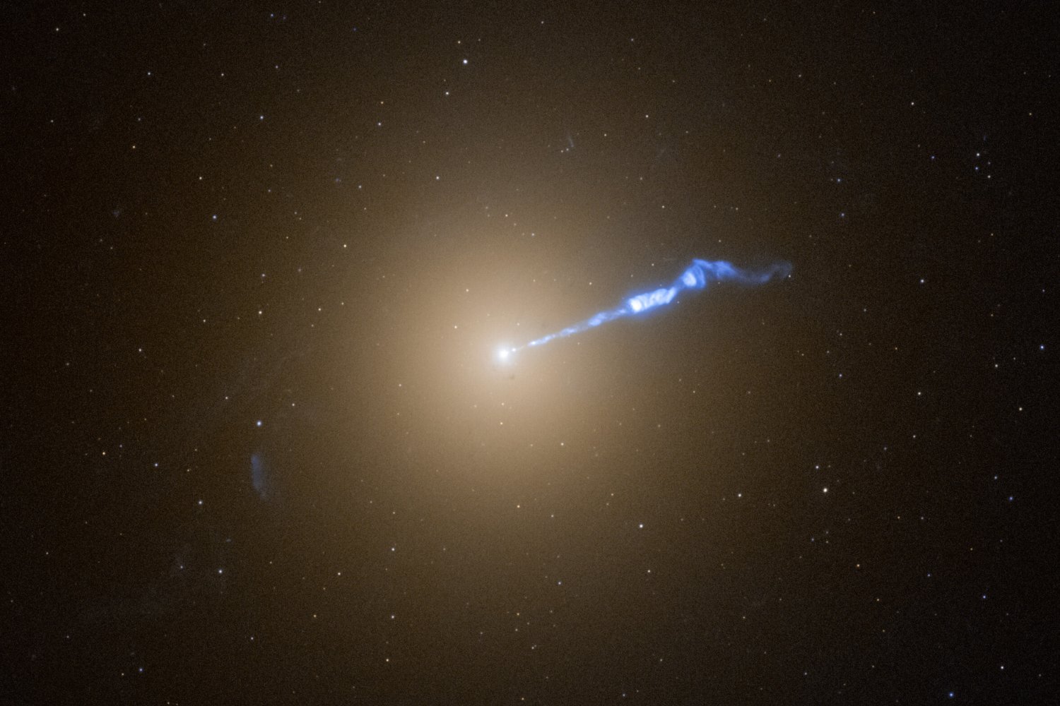 A Hubble Space Telescope image of the plasma jet spewing from M87.