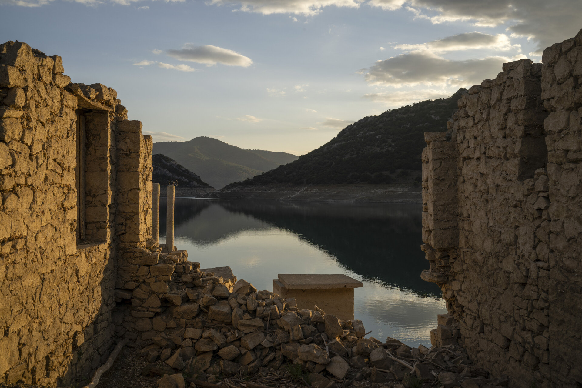 An abandoned house revealed by the Mornos artificial lake's significant drop in water level.