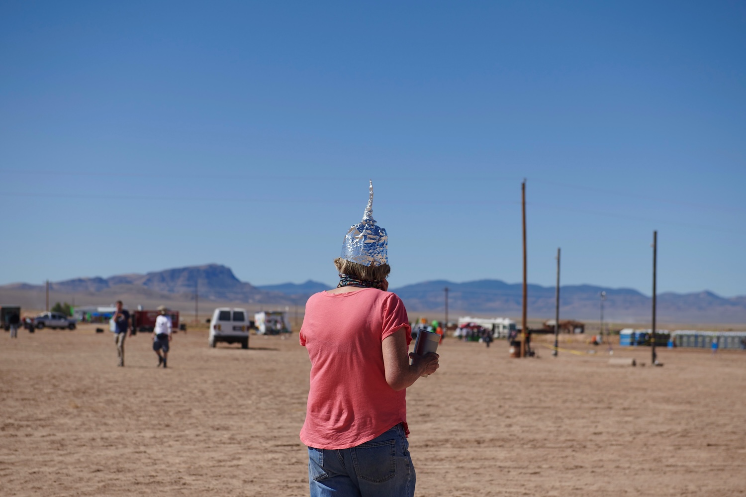 A woman wears a tinfoil hat at Alienstock festival on the "Extraterrestrial Highway" in Rachel, Nevada on September 20, 2019.