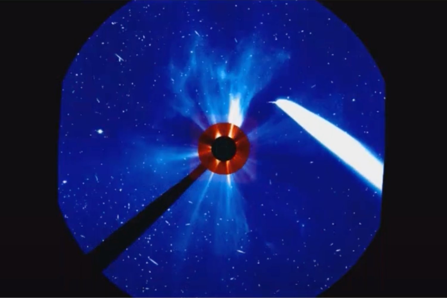 A Space Weather Prediction Center image of the CME issuing from the Sun, an irrelevant comet at right.