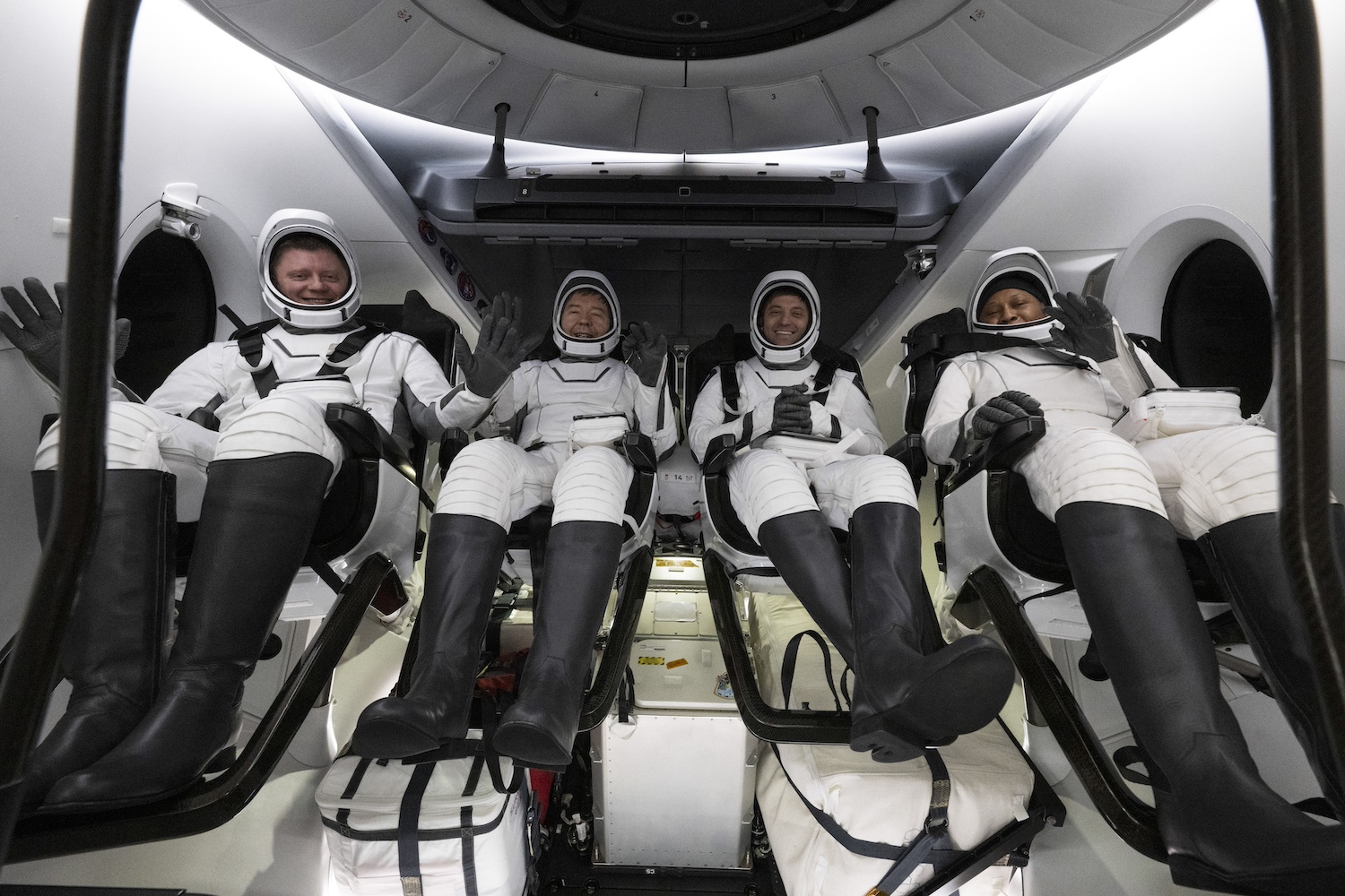 Roscosmos cosmonaut Alexander Grebenkin, left, NASA astronauts Michael Barratt, second from left, Matthew Dominick, second from right, and Jeanette Epps, right are seen inside the SpaceX Dragon Endeavour spacecraft onboard the SpaceX recovery ship MEGAN shortly after having landed in the Gulf of Mexico off the coast of Pensacola, Florida, Friday, Oct. 25, 2024. Dominick, Barratt, Epps, Grebenkin are returning after seven-months in space as part of Expedition 70 aboard the International Space Station.