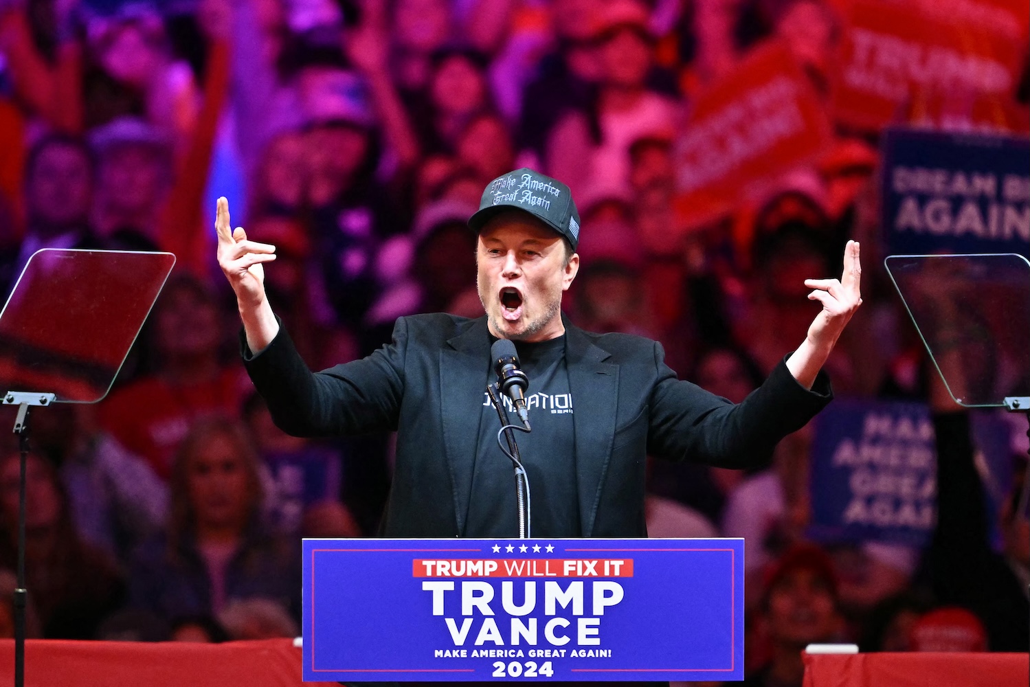 Elon Musk yells at a neo-fascist rally for Donald Trump at Madison Square Garden in New York on Oct. 27, 2024.