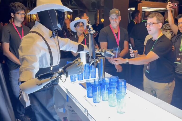 A human-assisted Tesla robot known as Optimus pouring drinks at an event Oct. 10, 2024 at Warner Bros. in Burbank, California. Screenshot from a video by Robert Scoble 