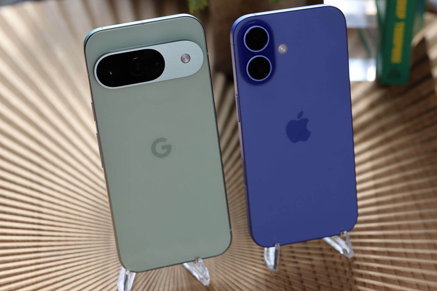 Back panels of iPhone 16 and Pixel 9 side by side