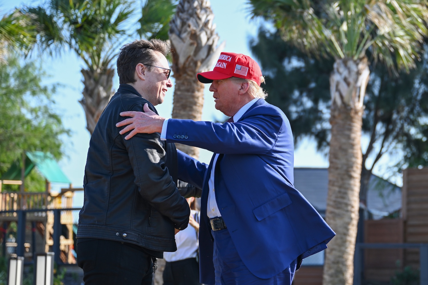 Donald Trump greets Elon Musk as he arrives to attend a viewing of the launch of the sixth test flight of the SpaceX Starship rocket on November 19, 2024 in Brownsville, Texas.