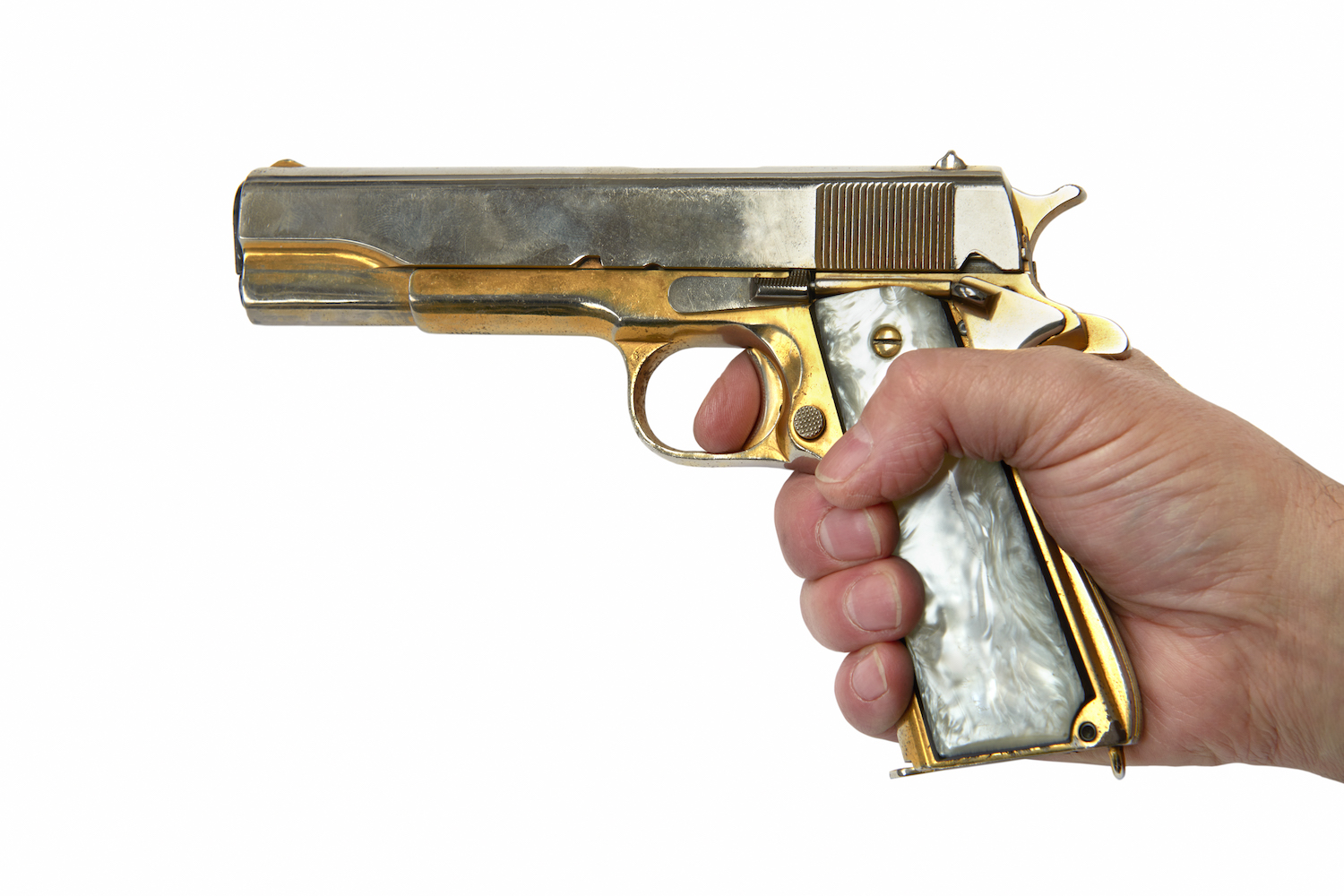 A person holding a golden gun