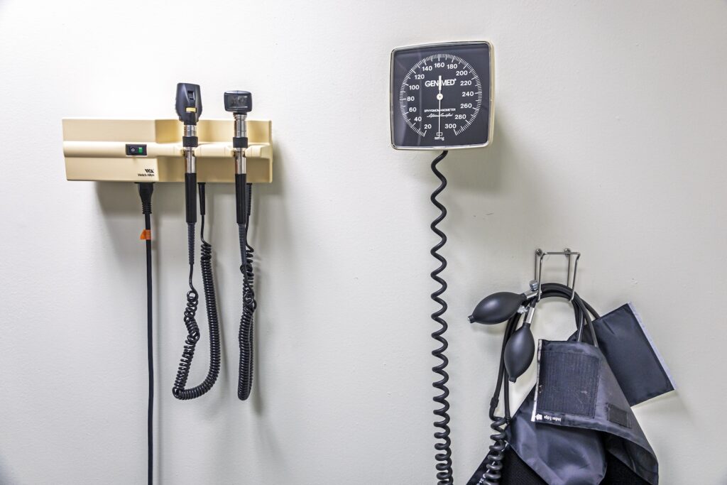 Doctors office equipment on a wall.