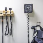 Doctors office equipment on a wall.